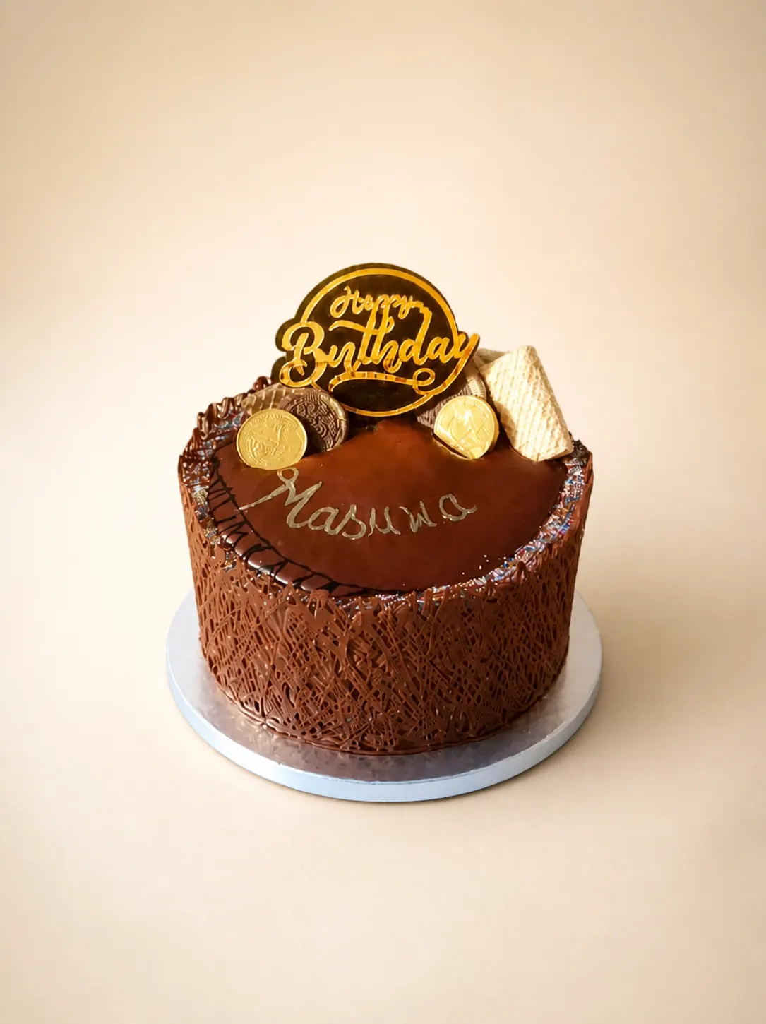 A dark chocolate cake finished with piped rosettes