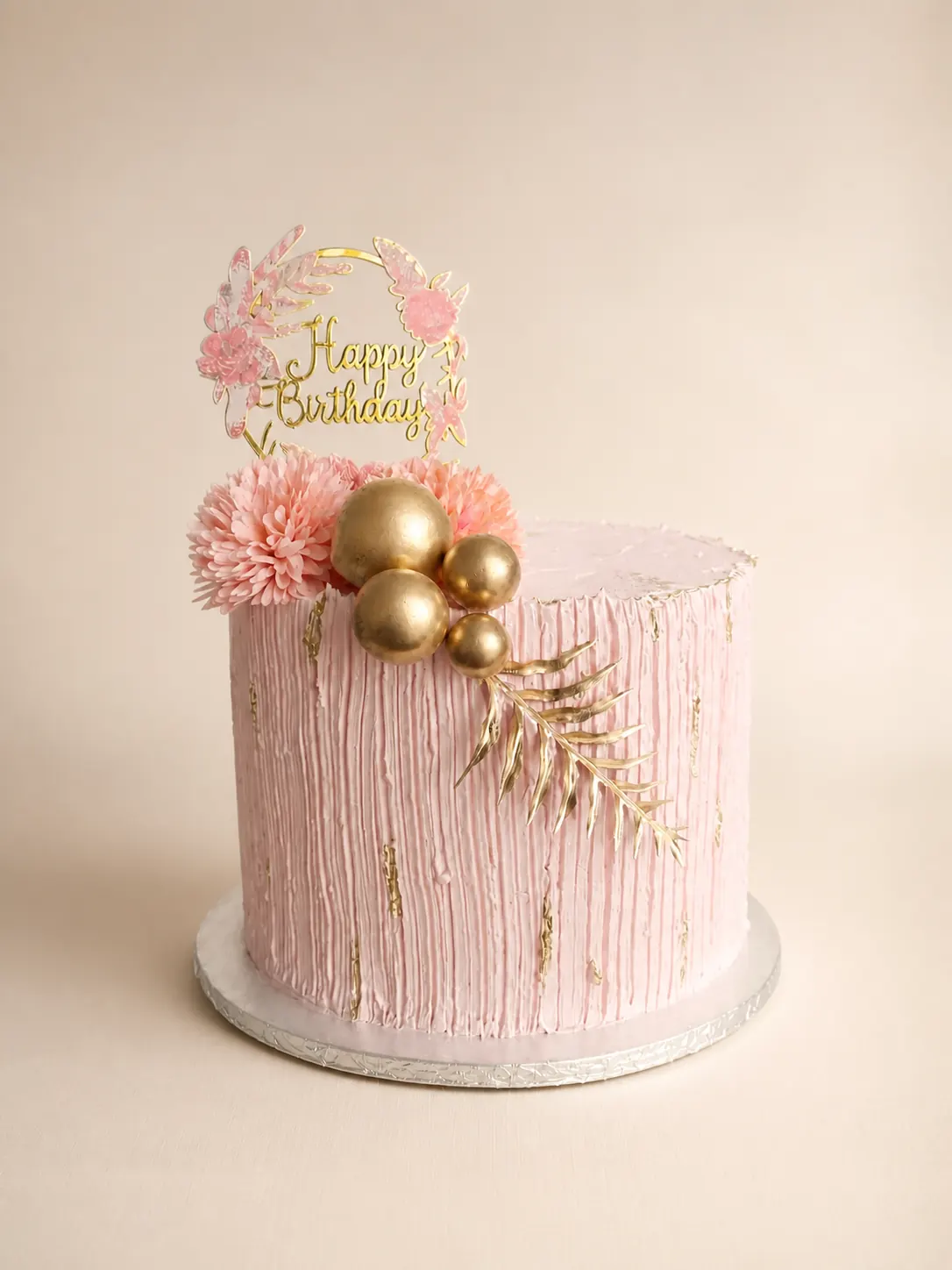 A hand-piped themed cake with a combed buttercream finish